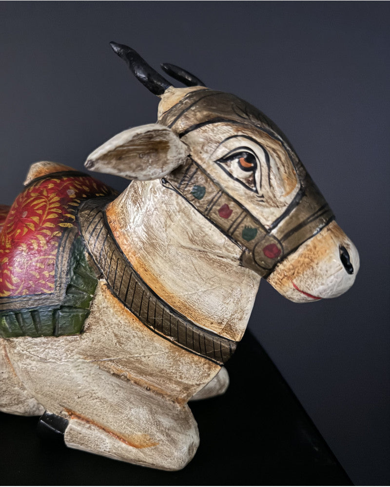 Small statue of a reclining white zebu