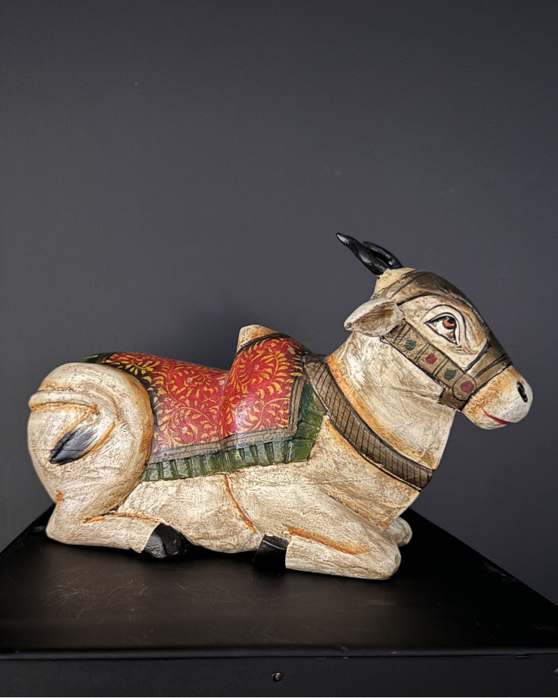 Small statue of a reclining white zebu