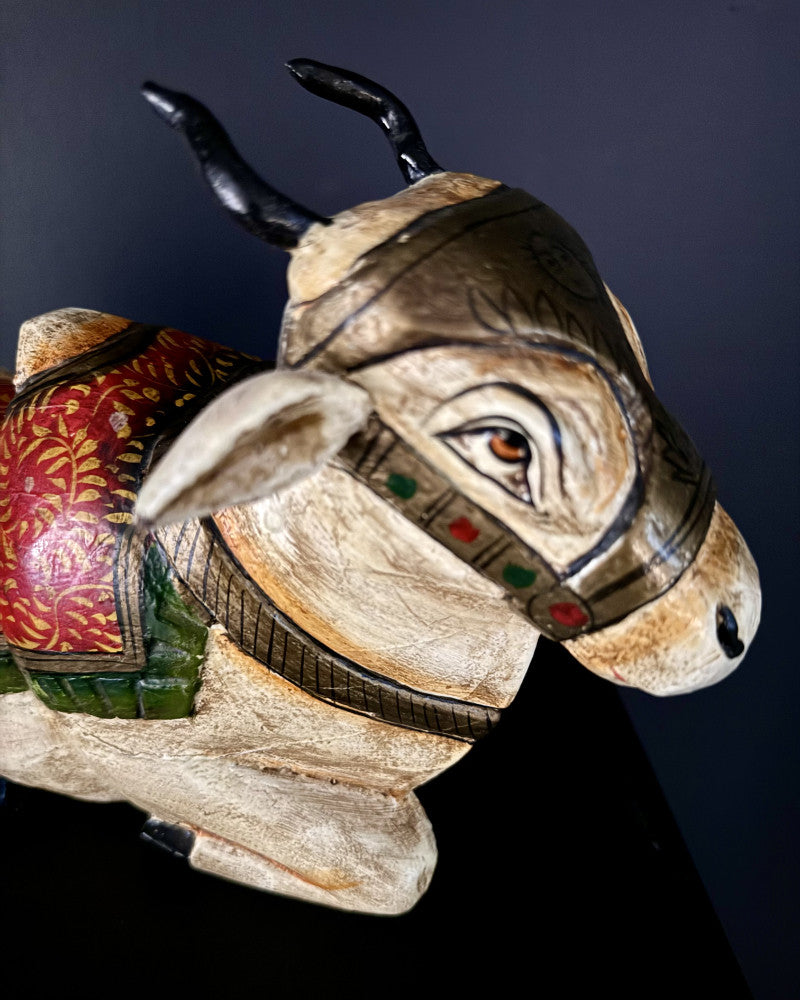 Small statue of a reclining white zebu